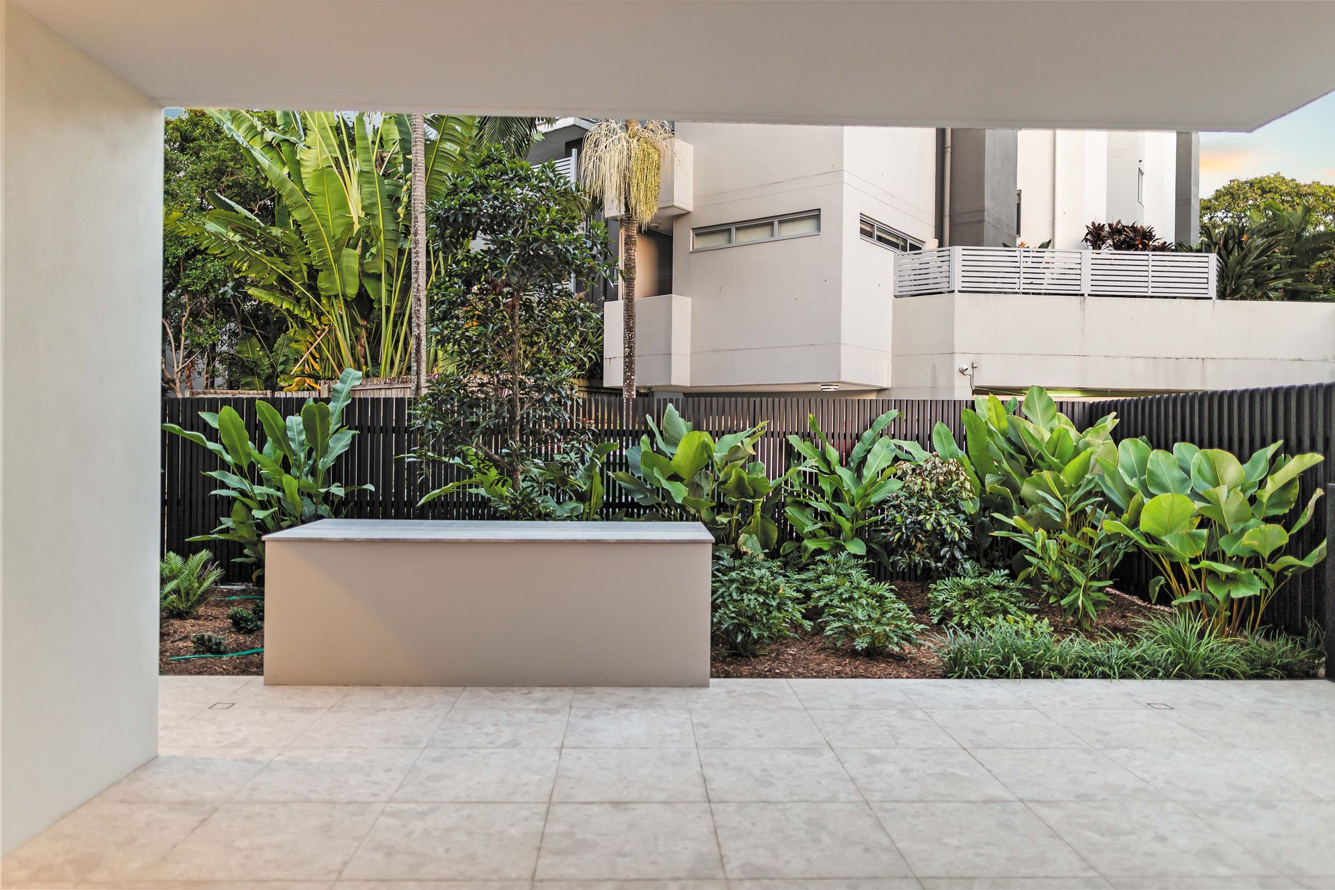 Ground floor courtyard with tropical landscaping
