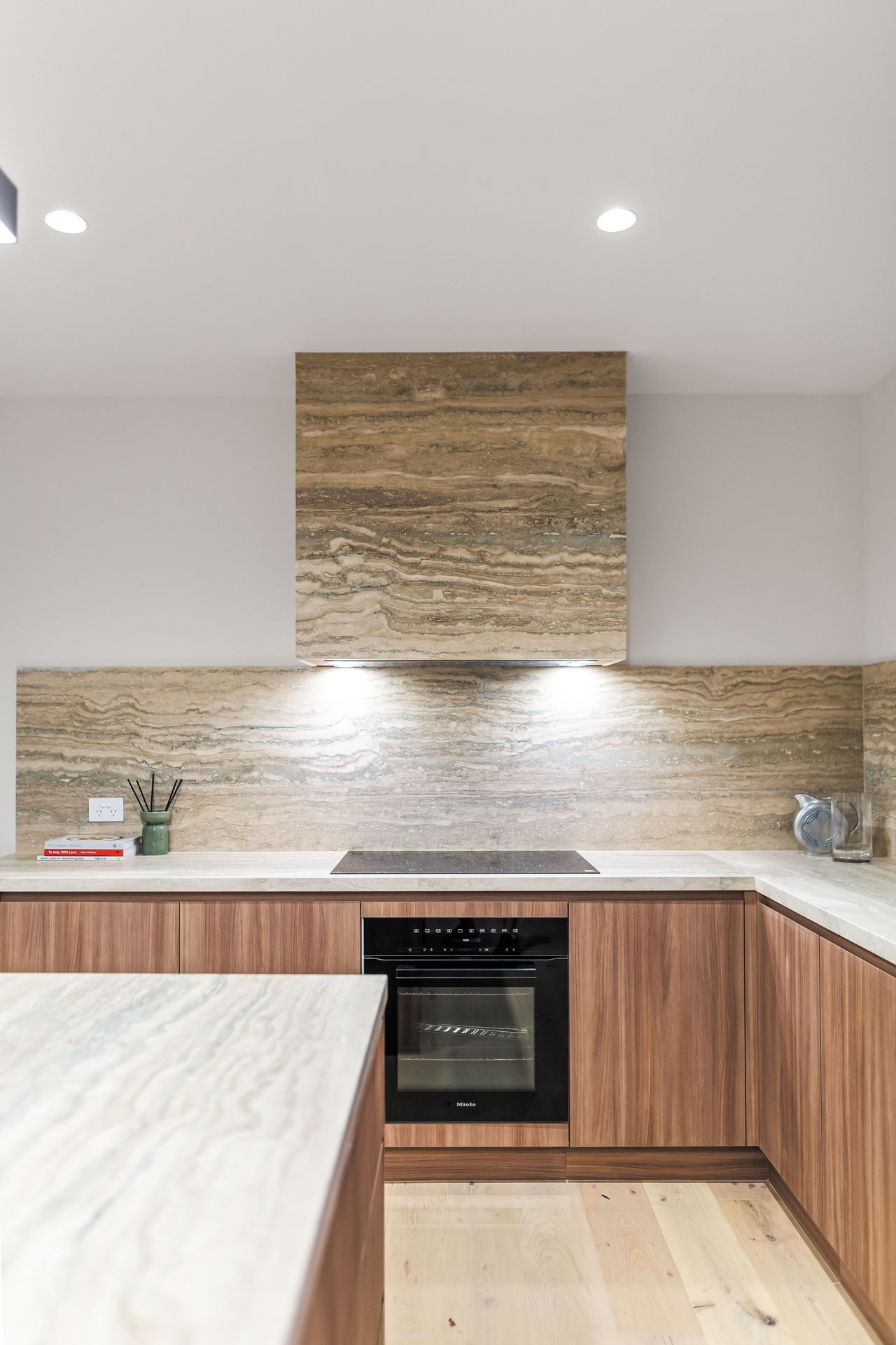 Kitchen - stone splashback and rangehood detail